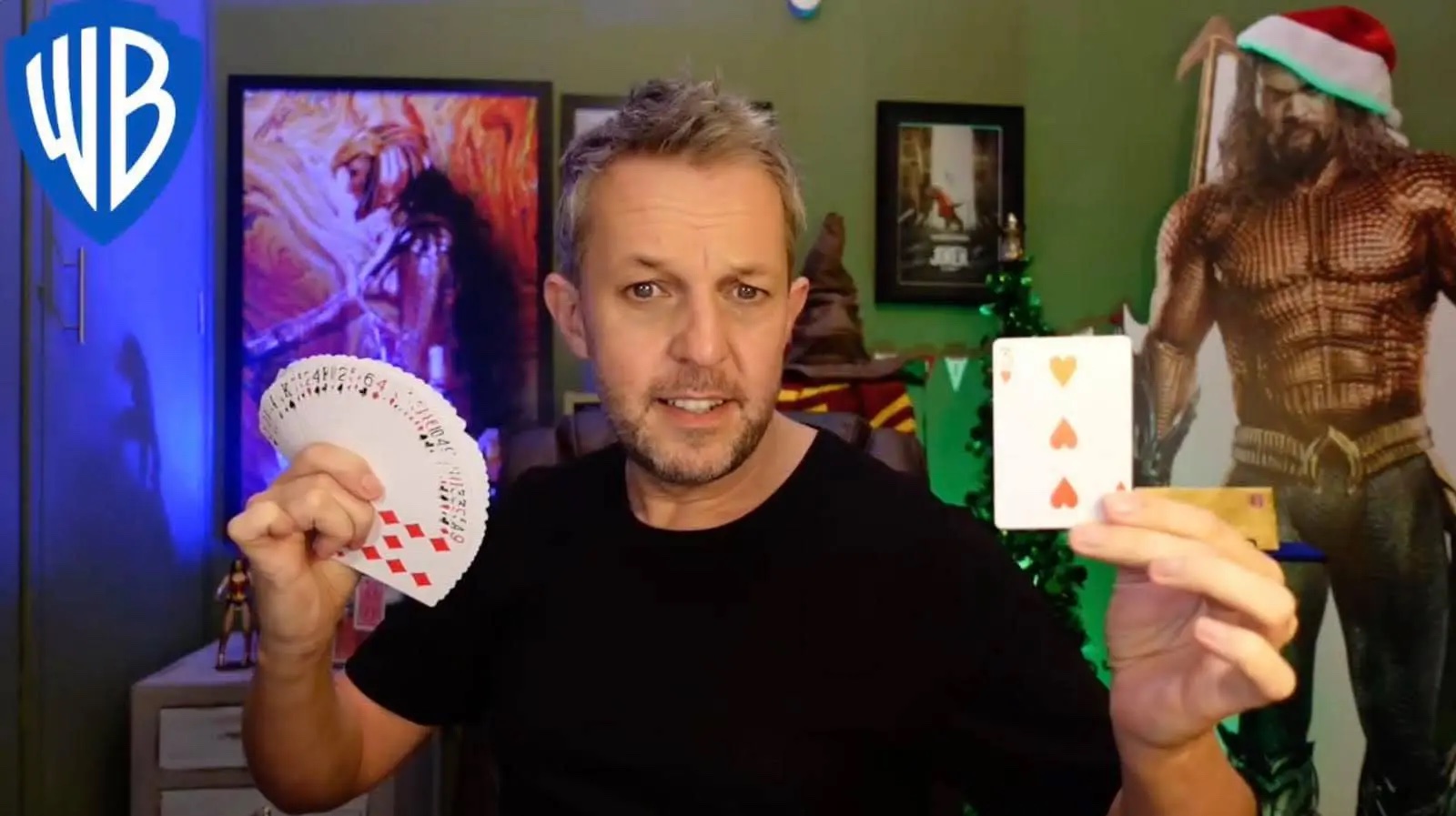 Virtual magician Alan Hudson performing a magic trick in a Zoom Call